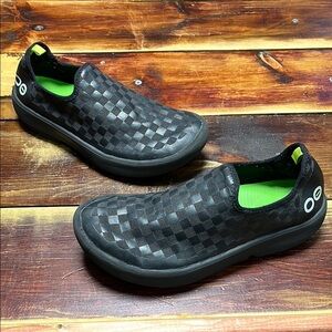 Woman’s OOFOS Black Checkered Slip-On Shoes